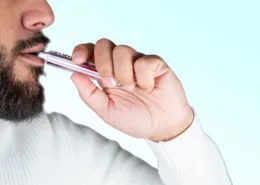 a man is vaping a disposable vape